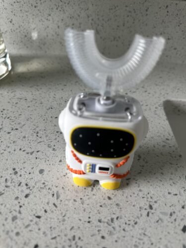Sensory 360 Round U-Shaped Astronaut Design Mouthguard Electric Toothbrush for Kids Ages 2-7 - Automatic Memory Function - 5 Modes Toothbrush with Multiple Heads – Kids Travel Essentials (White) photo review